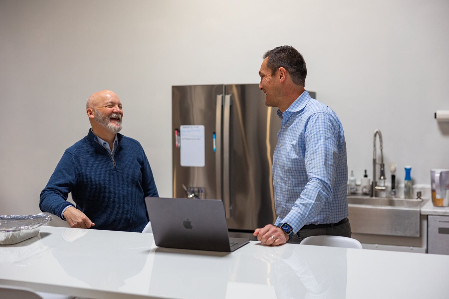 Two Compoze Labs team members reviewing work on screen